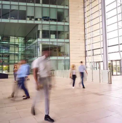 Business people walking in office lobby